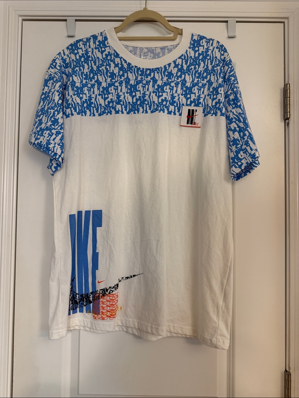 Nike Air Retro White Tee with Blue Graphic Yoke and Bold Logo